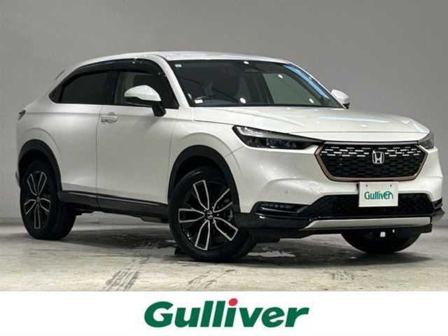 ホンダ ヴェゼル ハイブリッド e:HEV Z 宮城県 2021(令3)年 6.4万km プラチナホワイトパール ホンダセンシング/・衝突軽減ブレーキ/・誤発進抑制機能/・アダプティブクルーズコントロール/・オートハイビーム/・パーキングセンサーシステム/・後退出庫サポート/・ブラインドスポットインフォメーション/・Honda CONNECTディスプレー/・マルチビューカメラシステム/純正ＳＤナビ/Ｂｌｕｅｔｏｏｔｈ/全方位車外カメラ/フルセグＴＶ（キャンセラー付き）/純正ビルドインＥＴＣ２．０/パドルシフト/ワイヤレス充電器/純正18インチアルミホイール/シートヒーター/パワーシート/アイドリングストップ/プッシュスタート/ウィンカーミラー/プッシュスタート/電動リアゲート