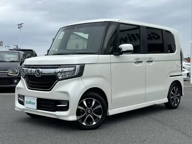 ホンダ Ｎ ＢＯＸ カスタム G L ホンダセンシング 奈良県 2018(平30)年 4.4万km プレミアムホワイトパールⅡ 純正7インチナビ（VXM-184VFi）/（フルセグ/BT/CD/DVD）/レーダークルーズコントロール/バックカメラ/後方コーナーセンサー/衝突軽減システム/レーンキープアシスト/片側パワースライドドア/後席サンシェード/LEDヘッドライト/オートライト/ETC/前方ドライブレコーダー/純正14インチAW/スペアキーX1