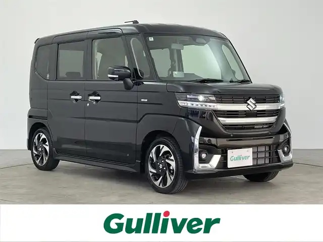 スズキ スペーシア カスタム HYBRID XS 大分県 2024(令6)年 0.7万km ブルーイッシュブラックパール3 純正メモリナビ/スズキセーフティーサポート/ヘッドアップディスプレイ/ステアリングヒーター/両側パワースライドドア/シートヒーター（前席）/USB入力端子/コーナーセンサー/純正アルミホイル15インチ/革巻ステアリング/革巻シフトノブ/プッシュスタート/スマートキー