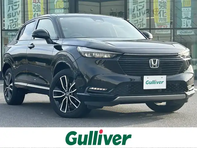 ホンダ ヴェゼル ハイブリッド e:HEV Z 岡山県 2021(令3)年 8.3万km クリスタルブラックパール 純正9インチナビ/（AM/FM/CarPlay/TV/BT）/バックカメラ/ハーフレザーシート/D/N席シートヒーター/ホンダセンシング/・衝突軽減ブレーキ/・アダプティブクルーズコントロール/・クリアランスソナー/・パーキングサポートブレーキ/・標識認識システム/・ヒルディセントコントロール/ビルトインETC2.0/ワイヤレス充電/純正18インチアルミホイール/パワーバックドア/LEDヘッドライト/スマートキー