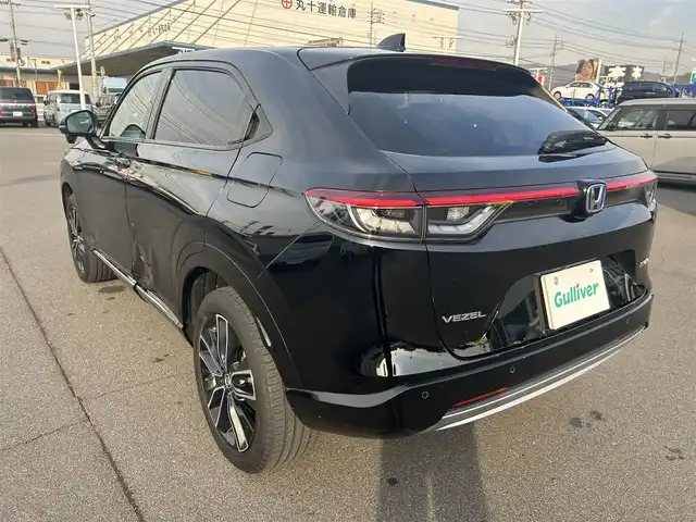 ホンダ ヴェゼル ハイブリッド e:HEV Z 岡山県 2021(令3)年 8.3万km クリスタルブラックパール 純正9インチナビ/（AM/FM/CarPlay/TV/BT）/バックカメラ/ハーフレザーシート/D/N席シートヒーター/ホンダセンシング/・衝突軽減ブレーキ/・アダプティブクルーズコントロール/・クリアランスソナー/・パーキングサポートブレーキ/・標識認識システム/・ヒルディセントコントロール/ビルトインETC2.0/ワイヤレス充電/純正18インチアルミホイール/パワーバックドア/LEDヘッドライト/スマートキー