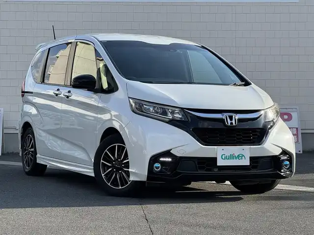 ホンダ フリード モデューロX ホンダセンシング 静岡県 2018(平30)年 6.7万km ホワイトオーキッドパール ●社外ディスプレイオーディオ/(CD/DVD/Bluetooth/AUX)/●レーダークルーズコントロール/●衝突被害軽減システム/●レーンキープアシスト/●両側パワースライド/●LEDライト＆フォグランプ/●オートライト/●革巻きステアリング/●ステアリングスイッチ/●ETC/●前方ドライブレコーダー/●スマートキー/●プッシュスタート/●純正フロアマット/●純正15インチアルミホイール/●W＋サイドSRS＋ABS