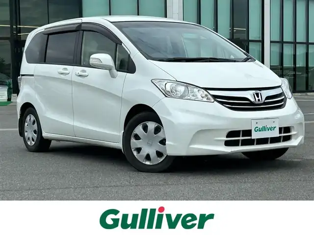 ホンダ フリード G ジャストセレクション 奈良県 2013(平25)年 1.7万km ホワイトオーキッドパール 社外ナビ　/フルセグ　/ＤＶＤ　/ＵＳＢ入力端子　/Ｂｌｕｅｔｏｏｔｈ　/バックカメラ　/ＥＴＣ　/片側パワースライドドア　/純正ラバーフロアマット　/オートライト　/横滑り防止装置　/ワンオーナー　/スペアキー１本　/保証書
