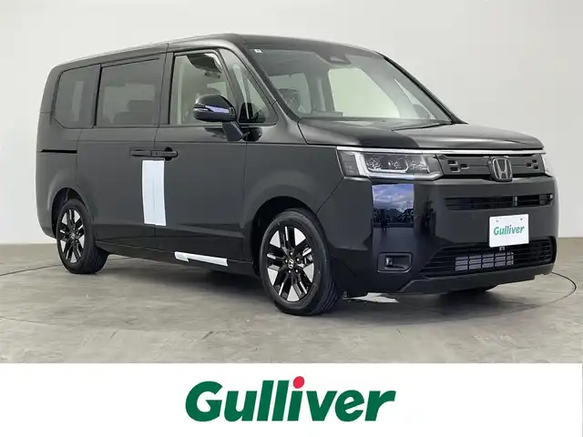 ホンダ ステップワゴン エアー EX 大分県 2025(令7)年 0.1千km クリスタルブラックパール 登録済未使用車/7人乗り/ホンダセンシング/・衝突軽減ブレーキ/・先行車発進お知らせ機能/・歩行者事故低減ステアリング/・路外逸脱抑制機能/・標識認識機能/・渋滞追従機能付アダプティブクルーズコントロール/・車線維持支援システム/・トラフィックジャムアシスト/・ブラインドスポットインフォメーション/・誤発進抑制機能/・後方誤発進抑制機能/・近距離衝突軽減ブレーキ/・急アクセル抑制機能/・パーキングセンサーシステム/・オートハイビーム/純正11.4型ナビ　型式：LXM-247VFLi/・フルセグTV、DVD再生可、BT対応、USB/・AppleCarPlay、AndroidAuto/ステアリングスイッチ/バックカメラ/両側電動スライドドア/パワーテールゲート（メモリー機能付）/前席シートヒーター/2列目オットマン/パドルシフト/横滑り防止装置/電動格納ミラー/オートライト/LEDヘッドライト/LEDフォグ/純正16インチアルミホイール/保証書、取説、スペアキー有り