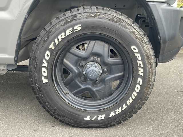 スズキ ジムニー XC 茨城県 2020(令2)年 4.2万km ミディアムグレー ワンオーナー/社外9型ナビ/ビルトインETC/シートヒーター/ドライブレコーダ/バックカメラ/LEDヘッドライト/横滑り防止装置/衝突軽減システム/オートライト/純正16インチアルミホイール/純正フロアマット/４WD/スマートキー