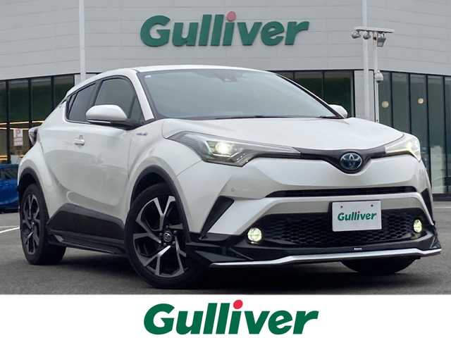 トヨタ Ｃ－ＨＲ G 佐賀県 2017(平29)年 6万km ホワイトパールクリスタルシャイン モデリスタエアロ/純正9インチナビ/バックカメラ/トヨタセーフティセンス/・プリクラッシュセーフティ/・レーンディパーチャーアラート/・オートハイビーム/・アダプティブクルーズコントロール/クリアランスソナー/ブラインドスポットモニター/リアクロストラフィックアラート/ハーフレザーシート/シートヒーター/電動パーキングブレーキ/オートブレーキホールド/ETC2.0/ドライブレコーダー/ステアリングリモコン/プッシュスタート/スマートキー/LEDヘッドライト/フォグライト/純正アルミホイール