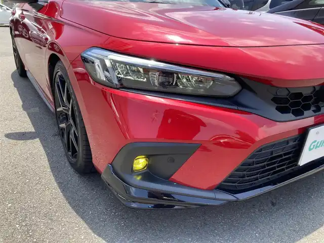 ホンダ シビック EX 静岡県 2023(令5)年 2.8万km プレミアムクリスタルレッドM HondaSENSING/純正メモリーナビ/　AM FM Bluetooth USB/ビルトインETC2.0/バックモニター/前後方ドライブレコーダー/LEDオートヘッドランプ/レーダークルーズコントロール/ハーフレザーシート/シートヒーター(前席)/ワイヤレス充電/前後方クリアランスソナー/純正18インチアルミホイール/ターボ/社外柿本改マフラー/6速MT/BOSEプレミアムサウンド/フルセグTV/パワーシート(前席)