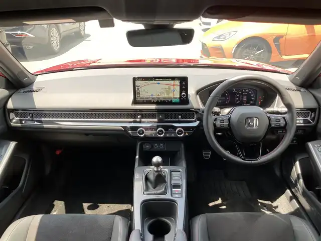 ホンダ シビック EX 静岡県 2023(令5)年 2.8万km プレミアムクリスタルレッドM HondaSENSING/純正メモリーナビ/　AM FM Bluetooth USB/ビルトインETC2.0/バックモニター/前後方ドライブレコーダー/LEDオートヘッドランプ/レーダークルーズコントロール/ハーフレザーシート/シートヒーター(前席)/ワイヤレス充電/前後方クリアランスソナー/純正18インチアルミホイール/ターボ/社外柿本改マフラー/6速MT/BOSEプレミアムサウンド/フルセグTV/パワーシート(前席)