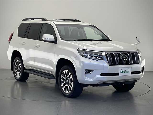 トヨタ ランドクルーザー プラド TX Lパッケージ 長野県 2022(令4)年 2.8万km ホワイトパールクリスタルシャイン 4WD/純正9インチSDナビ/Bluetooth／CD／DVD／フルセグTV/バックカメラ/サンルーフ/ルーフレール/黒革シート/前席シートヒーター／エアシート/前席パワーシート/電動格納サードシート/横滑り防止装置/衝突軽減被害システム/レーンキープアシスト/先行車発進告知/純正19インチAW装着/純正フロアマット/前後コーナーセンサー/ステアリングスイッチ/LEDヘッドライト/フロントフォグランプ/スマートキー/スペアキー1本