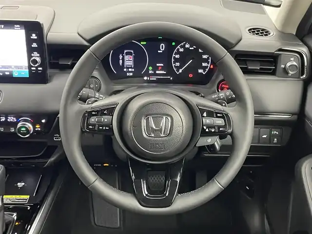 ホンダ ヴェゼル ハイブリッド e:HEV Z 埼玉県 2025(令7)年 0.1千km クリスタルブラックパール 登録済未使用車　バックカメラ　ＢＳＩ　アダクティブクルーズコントロール　ビルトインＥＴＣ２．０　シートヒーター　ワイヤレス充電　衝突軽減ブレーキ　ハーフレザー　ＬＥＤヘッドライト　オートライト　地デジ