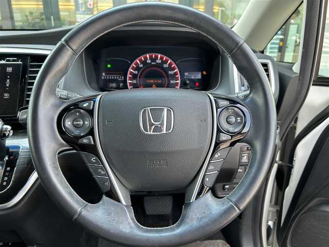 ホンダ オデッセイ アブソルート 栃木県 2015(平27)年 6.6万km ホワイトオーキッドパール ホンダセンシング/・SMBS(衝突軽減ブレーキ)/・誤発進抑制機能/・先行車発進お知らせ機能/・標識認識機能/・LKAS(車線維持支援システム）/・路外逸脱抑制機能/・ACC(アダプティブクルーズコントロール)/純正ナビ/フルセグTV/DVD/Bluetooth/USB/HDMI/バックカメラ/ビルトインETC/ミラー型前後ドライブレコーダー/純正フリップダウンモニター/パドルシフト/コーナーセンサー/ハーフレザーシート