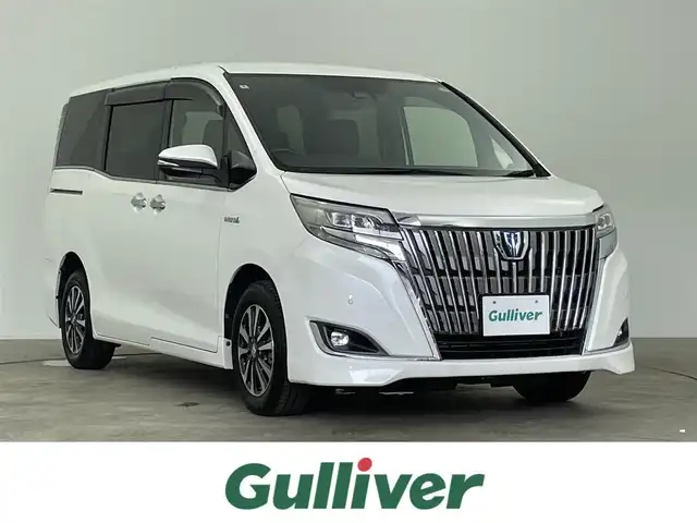 トヨタ エスクァイア ハイブリッド Gi プレミアムパッケージ 千葉県 2018(平30)年 5万km ホワイトパールクリスタルシャイン 禁煙車/両側電動ドア/トヨタセーフティセンス/・レーンディパーチャーアラート/・先行車発進システム/・クルーズコントロール/・クリアランスソナー/純正7インチメモリナビ/・型番：NSZT-W66T/・CD/DVD/Bluetooth/フルセグTV/・バックカメラ/・ビルトインETC/社外フリップダウンモニター/ハーフレザーシート/・DNシートヒーター/革巻きステアリング/・ステアリングスイッチ/・ステアリングヒーター/左右独立エアコン/純正フロアマット/純正15インチAW/電動格納ウインカーミラー/オートライト/・オートマチックハイビーム/・LEDヘッドライト/・LEDフォグランプ