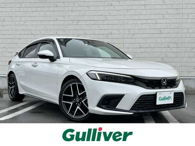 ホンダ シビック LX 静岡県 2022(令4)年 4.3万km プラチナホワイトパール HondaSENSING/Google搭載9インチHonda CONNECTナビ/　AM FM Bluetooth USB AppleCarPlay AndroidAuto/フルセグTV/バックモニター/前後方ドライブレコーダー/LEDオートヘッドライト/レーダークルーズコントロール/ハーフレザーシート/シートヒーター(前席)/純正18インチアルミホイール/スマートキー2本/前後方クリアランスソナー/パドルシフト/ワンオーナー/リアウイング/ビルトインETC2.0