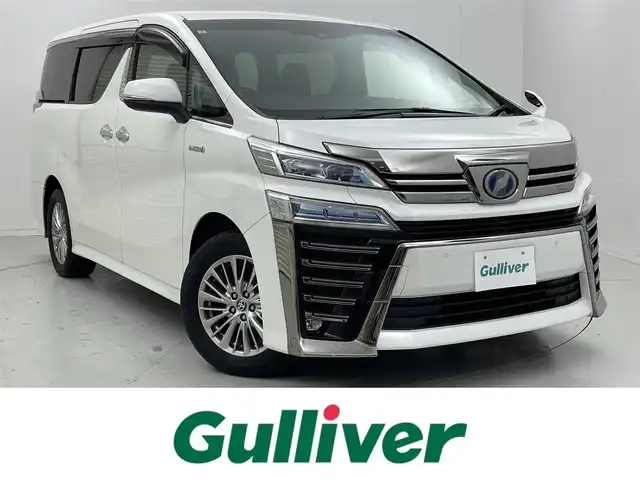トヨタ ヴェルファイア ハイブリット ZR 茨城県 2019(令1)年 4.6万km ホワイトパールクリスタルシャイン 純正T-connectナビ/・AM/FM/CD/DVD/Bluetooth/・フルセグテレビ/フリップダウンモニター/バックカメラ/ビルトインETC2.0/ドライブレコーダー/クルーズコントロール/衝突軽減ブレーキ/レーンキープアシスト/横滑り防止装置/盗難防止装置/パドルシフト/電動パーキングブレーキ/両側パワースライド/前後コーナーセンサー/メモリシート（D席）/パワーシート（D席+N席）/エアシート（D席+N席）/シートヒーター（D席+N席）/LEDヘッドライト/オートマチックハイビーム/オートライト/ダブルオートエアコン/プッシュスタートボタン/ステアリングリモコン/純正17インチアルミホイール/12V充電器/純正フロアマット/ドアバイザー