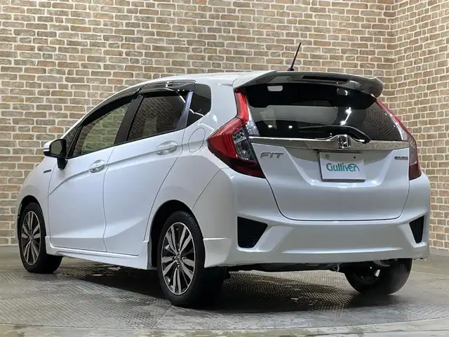 ホンダ フィット ハイブリット Sパッケージ 岩手県 2015(平27)年 9.5万km ホワイトオーキッドパール 純正ナビ/フルセグTV/バックカメラ/ドライブレコーダー/ETC/安心パッケージ/シティブレーキアクティブシステム/クルーズコントロール/パドルシフト/横滑り防止装置/大型テールゲートスポイラー/ステンレス製スポーツペダル/本革巻きステアリング/チップアップリアシート/スペアキー/オートライト/LEDヘッドライト/純正16インチアルミホイール/純正フロアマット