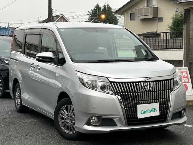 トヨタ エスクァイア Gi 長崎県 2014(平26)年 8.5万km シルバーM 純正ナビ/AM/FM/フルセグ/BT/バックカメラ/両側パワースライドドア/フリップダウンモニター/ハーフレザーシート/パーキングアシスト/LEDヘッドライト/コーナーセンサー/ドライブレコーダー/オートマチックハイビーム/ETC/純正フロアマット/スペアキー有り（1本）/保証書/取扱説明書