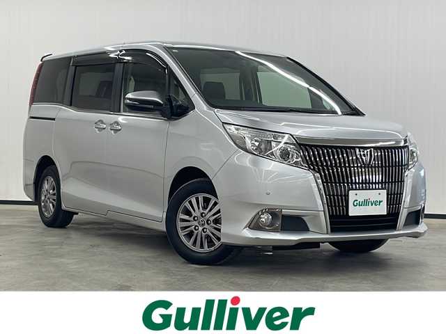 トヨタ エスクァイア Gi 長崎県 2014(平26)年 8.5万km シルバーM 純正ナビ/AM/FM/フルセグ/BT/バックカメラ/両側パワースライドドア/フリップダウンモニター/ハーフレザーシート/パーキングアシスト/LEDヘッドライト/コーナーセンサー/ドライブレコーダー/オートマチックハイビーム/ETC/純正フロアマット/スペアキー有り（1本）/保証書/取扱説明書