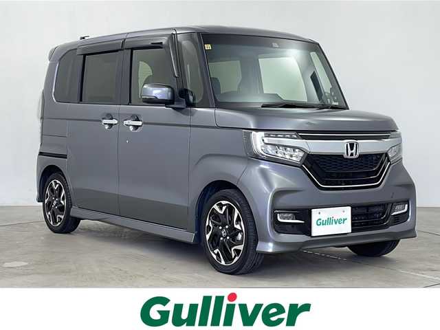 ホンダ Ｎ ＢＯＸ カスタム G L ターボ ホンダセンシング 鹿児島県 2020(令2)年 5.4万km シャイニンググレーM ホンダセンシング/純正8型プレミアムインターナビ/Bluetooth DVD再生可/フルセグTV/バックカメラ/両側電動スライドドア/レーダークルーズコントロール/ビルトインETC/ハーフレザーシート/前席シートヒーター /ビルトインETC/LEDヘッドライト/フォグライト /オートライトコントロール/革巻ステアリング/ステアリングスイッチ/レーンキープアシスト/純正15インチアルミホイール/バックセンサー/スマートキー/エンジンプッシュスタート/純正フロアマット/ドアバイザー/保証書