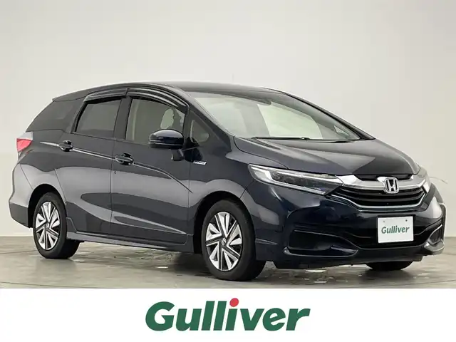ホンダ シャトル ハイブリッド X 滋賀県 2015(平27)年 6.8万km ミッドナイトブルービームM 禁煙車/純正ナビ/(CD/DVD/SD/Bluetooth/フルセグTV)/バックカメラ/ビルトインETC/シティーブレーキアクティブシステム/革巻きステアリング/クルーズコントロール/ステアリングリモコン/パドルシフト/ハーフレザーシート/LEDヘッドライト/オートヘッドライト/純正フロアマット/スペアキー