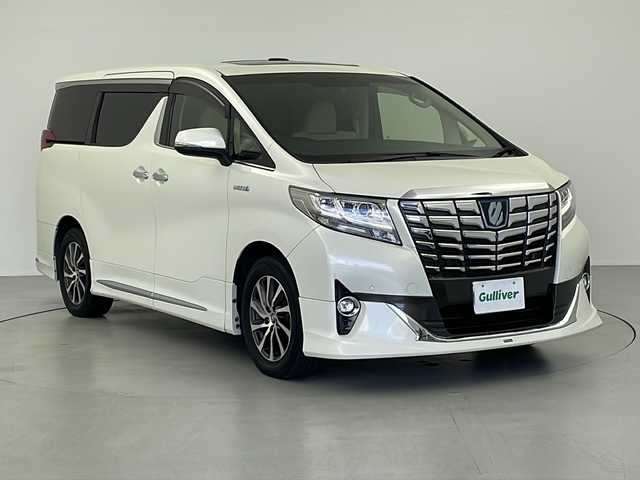トヨタ アルファードハイブリット エグゼクティブ ラウンジ 岐阜県 2015(平27)年 6.9万km ラグジュアリーホワイトパールクリスタルシャインガラスフレーク モデリスタエアロ/サンルーフ/プリクラッシュブレーキ/オートハイビーム/インテリジェンスクリアランスソナー/レーダークルーズコントロール/純正ナビ/JBL/純正フリップダウンモニター/パノラミックビューモニター/フルセグTV/Bluetooth/CD/DVD/HDMI/ビルトインETC/レザーシート/シートヒーター/ベンチレーション（後席）/パワーシート/シートメモリ/ステアリングスイッチ/ステアリングヒーター/パワーバックドア