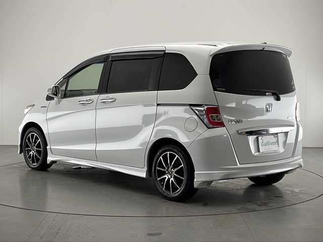 ホンダ フリード ハイブリット ジャストセレクション 宮崎県 2015(平27)年 6.3万km ホワイトオーキッドパール ワンオーナー/純正7インチSDナビ/ワンセグTV/CD/DVD/Bluetooth/バックカメラ/両側パワースライドドア/クルーズコントロール/ビルトインETC/ディスチャージヘッドライト/社外16インチAW
