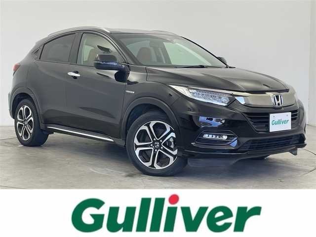 ホンダ ヴェゼル ハイブリッド Z ホンダセンシング 富山県 2019(令1)年 2.3万km クリスタルブラックパール 純正ナビ(VXM-195VFi)/・Bluetooth/・CD/DVD/・フルセグ/ホンダセンシング(安全運転支援システム)/・衝突軽減ブレーキ/・誤発進抑制機能/・歩行者事故低減ステアリング/・路外逸脱抑制機能/・アダプティブクルーズコントロール/・車線維持支援システム/・先行車発進お知らせ機能/・標識認識機能/LEDヘッドランプ/オートライト/LEDフロントフォグランプ/ルーフレール/パドルシフト/左右独立温度調整オートエアコン/シートヒーター(運転席/助手席)/スマートキーシステム/SRSエアバック(運転席/助手席/サイド/カーテン)/純正アルミホイール(215/55/R17)