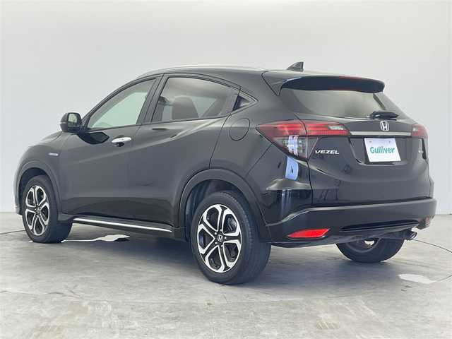 ホンダ ヴェゼル ハイブリッド Z ホンダセンシング 富山県 2019(令1)年 2.3万km クリスタルブラックパール 純正ナビ(VXM-195VFi)/・Bluetooth/・CD/DVD/・フルセグ/ホンダセンシング(安全運転支援システム)/・衝突軽減ブレーキ/・誤発進抑制機能/・歩行者事故低減ステアリング/・路外逸脱抑制機能/・アダプティブクルーズコントロール/・車線維持支援システム/・先行車発進お知らせ機能/・標識認識機能/LEDヘッドランプ/オートライト/LEDフロントフォグランプ/ルーフレール/パドルシフト/左右独立温度調整オートエアコン/シートヒーター(運転席/助手席)/スマートキーシステム/SRSエアバック(運転席/助手席/サイド/カーテン)/純正アルミホイール(215/55/R17)