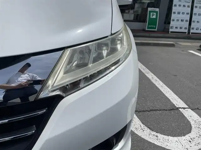 ホンダ オデッセイ G 長野県 2013(平25)年 10.7万km ホワイトオーキッドパール 純正ナビ（FM/AM、CD、DVD、BT）/バックカメラ/フルセグテレビ/クルーズコントロール追従無/両側パワースライド/レーンキープアシスト/横滑り防止装置/盗難防止装置/アイドリングストップ/LEDオートライト/リモコンキー/ワンオーナー/MTモード付AT/社外フロアマット/保証書
