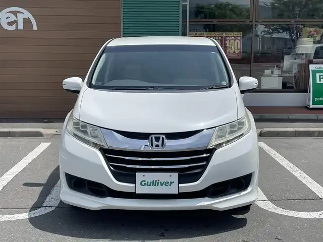 ホンダ オデッセイ G 長野県 2013(平25)年 10.7万km ホワイトオーキッドパール 純正ナビ（FM/AM、CD、DVD、BT）/バックカメラ/フルセグテレビ/クルーズコントロール追従無/両側パワースライド/レーンキープアシスト/横滑り防止装置/盗難防止装置/アイドリングストップ/LEDオートライト/リモコンキー/ワンオーナー/MTモード付AT/社外フロアマット/保証書