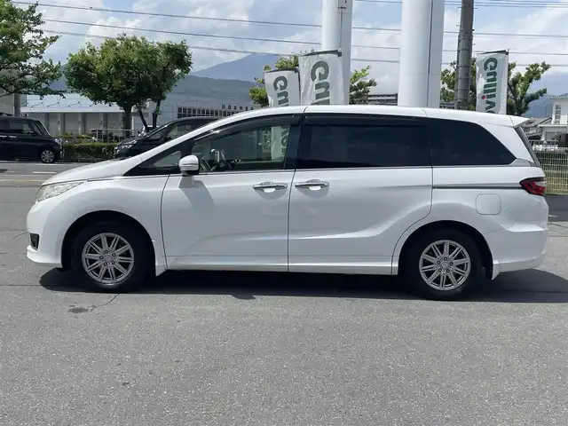 ホンダ オデッセイ G 長野県 2013(平25)年 10.7万km ホワイトオーキッドパール 純正ナビ（FM/AM、CD、DVD、BT）/バックカメラ/フルセグテレビ/クルーズコントロール追従無/両側パワースライド/レーンキープアシスト/横滑り防止装置/盗難防止装置/アイドリングストップ/LEDオートライト/リモコンキー/ワンオーナー/MTモード付AT/社外フロアマット/保証書