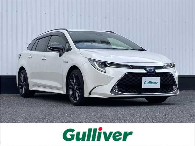 トヨタ カローラツーリング ハイブリッド ダブルバイビー 千葉県 2020(令2)年 6.4万km ホワイトパールクリスタルシャイン 純正9インチナビ/(フルセグTV BT CD DVD FM AM)/バックカメラ/衝突被害軽減システム/車線逸脱警報/クルーズコントロール/ハーフレザーシート/横滑り防止装置/ビルトインETC/アイドリングストップ/LEDヘッドライト/フォグランプ/オートライト/ウィンカーミラー/電動格納ミラー/純正17インチAW/シートヒーター/シートリフター/ステアリングヒーター/プッシュスタート/スマートキー/フロアマット/ドアバイザー/スペアキー/取扱説明書/保証書