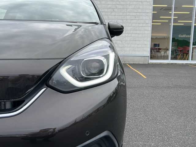 ホンダ フィット e:HEVホーム 茨城県 2020(令2)年 6.8万km プレミアムグラマラスブロンズP ホンダセンシング/純正ナビ/　　CD/DVD/SD/BT/フルセグ/バックカメラ/クルーズコントロール追従走行/LEDオートライト/ハーフレザー/純正15インチアルミホイール/スマートキー/ETC