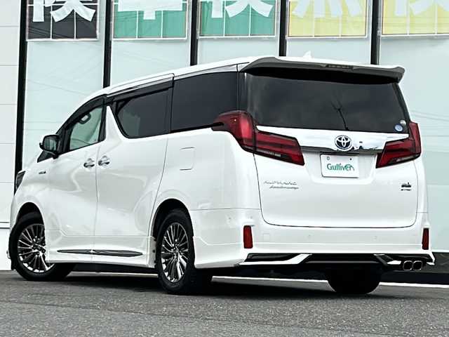 トヨタ アルファードハイブリット エグゼクティブ ラウンジ S 山形県 2021(令3)年 6.4万km ホワイトパールクリスタルシャイン 4WD/トヨタセーフティセンス/サンルーフ/モデリスタエアロ/純正ナビ/（Bluetooth/CD/DVD/フルセグ)/JBLプレミアムサウンドシステム/BSM/全方位カメラ/レーダークルーズコントロール/フリップダウンモニター/電動パーキングブレーキ/両側パワースライドドア/オートブレーキホールド/三眼LEDヘッドライト/ステアリングスイッチ/ドライブレコーダー/DN席・二列目シートヒーター/DN席・二列目エアシート/DN席・二列目パワーシート/シートメモリ/デジタルインナーミラー/ビルトインETC2.0/ステアリングヒーター/セーフティレーダー探知機/純正アルミホイール/電動格納ミラー/ウィンカーミラー/エンジンスターター/スマートキー/ドアバイザー/純正アルミホイールスタッドレス（4mm・17R）車載