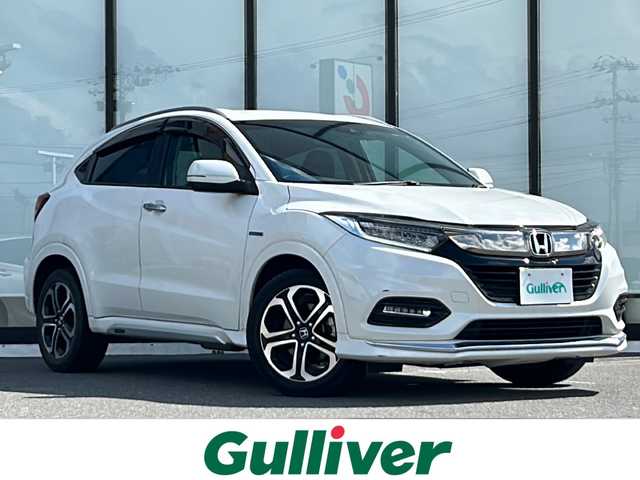 ホンダ ヴェゼル ハイブリッド Z ホンダセンシング 山形県 2020(令2)年 6.3万km プラチナホワイトパール ホンダセンシング/クルーズコントロール/純正8インチナビ/（フルセグTV/Bluetooth/CD/DVD）/Apple Car-Play/バックカメラ/ドライブレコーダー/ビルトインETC/ワイパーデアイサー/ステアリングスイッチ/パドルシフト/ハーフレザーシート/前席シートヒーター/純正17インチAW/モデューロエアロ/LEDヘッドライト/オートライト/フォグランプ/革巻きステアリング/電動パーキングスイッチ/スマートキー×２/保証書/禁煙車
