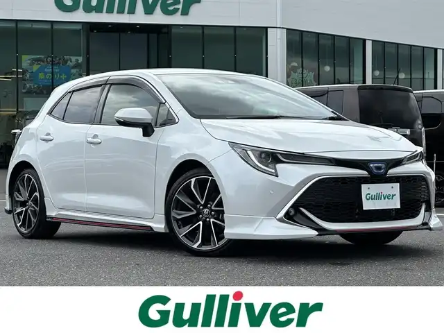 トヨタ カローラ スポーツ ハイブリッドG Z 島根県 2022(令4)年 3.3万km プラチナホワイトパールマイカ 登録時走行距離32321km/純正ディスプレイオーディオ（ナビ有）/(AM/FM/USB/BT/Mira Cast)/フルセグテレビ/バックカメラ/ビルトインETC/ドライブレコーダー前後/前席シートヒーター/衝突軽減ブレーキ/コーナーセンサー/レーダークルーズコントロール/レーンキープアシスト/オートハイビーム/LEDオートヘッドライト/ブラインドスポットモニター/純正フロアマット/純正18インチAW