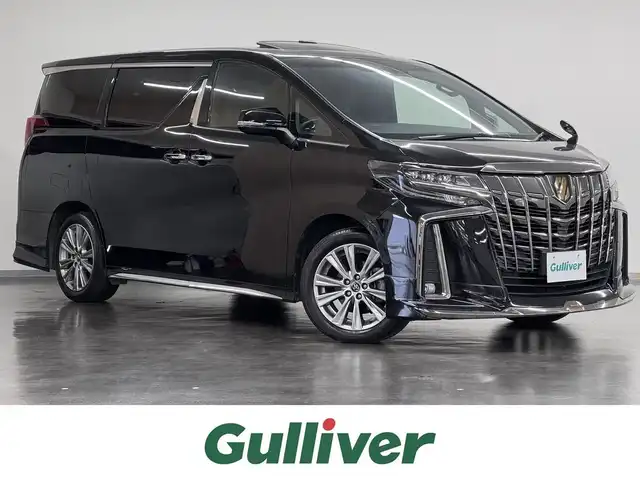 トヨタ アルファード S タイプゴールドⅡ 三重県 2022(令4)年 6.5万km ブラック ガソリン/FF/MTモード付インパネCVT/純正 9インチディスプレイオーディオ/（AM/FM/USB/iPod/Bluetooth/Miracast/AppleCarPlay/AndroidAuto）/モデリスタエアロ（F/R下）＋スポーツマフラー/バックガイドモニター/両側パワースライドドア/ETC/Toyota Safety Sense/●プリクラッシュセーフティ/●レーントレーシングアシスト/●レーダークルコン/●ロードサインアシスト/●アダプティブハイビームシステム/・【OP】ブラインドスポットモニター＋リヤクロストラフィックアラート*/・先行車発進告知機能/・パーキングサポートブレーキ（前後静止物＋後方接近車両*）/・など/装備/・3眼LEDヘッドランプ（専用加飾）/・3.5SC/2.5S Cパッケージ用大型ハイグレードコンソール（アームレスト付）/・ハーフレザーシート/・左右＆後席独立オートエアコン/・パワーバックドア/・オットマンシート（2nd）/・ステアリングスイッチ/・電子パーキングブレーキ＆ブレーキホールド/・オートライト/・純正18inAW/・保/取/ナビ取/・スマートキーx2/など