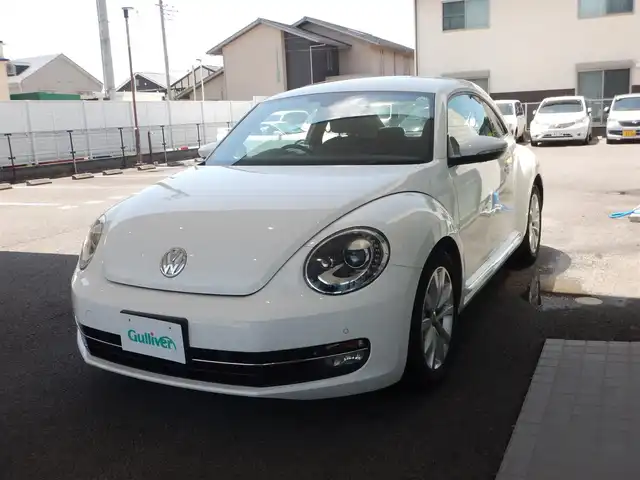 フォルクスワーゲン ザ・ビートル ミルク 静岡県 2014(平26)年 5.4万km 白 ストラーダCNーRA05D/BT接続/CD・DVD再生/バックカメラ/プッシュスタート/純正HID/オートライト/クルーズコントロール/プッシュスタート/フォグランプ/リアフォグランプ/ISOFIX/MTモードAT/本革巻ステアリング/純正フロアマット/スペアキー×1/取説/保証書