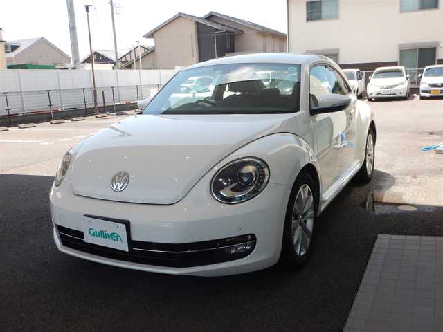 フォルクスワーゲン ザ・ビートル ミルク 宮崎県 2014(平26)年 5.4万km 白 ストラーダCNーRA05D/BT接続/CD・DVD再生/バックカメラ/プッシュスタート/純正HID/オートライト/クルーズコントロール/プッシュスタート/フォグランプ/リアフォグランプ/ISOFIX/MTモードAT/本革巻ステアリング/純正フロアマット/スペアキー×1/取説/保証書