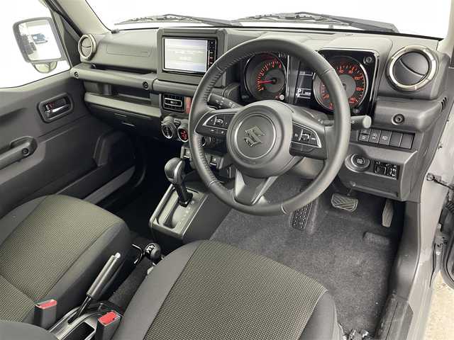 スズキ ジムニー XC 富山県 2022(令4)年 2万km ミディアムグレー 4WD/ワンオーナー/純正SDナビ（CN-RZ775W）/地図SD未着のため動作未確認/クルーズコントロール/レーンアシスト/ドライブレコーダー/前席シートヒーター/アイドリングストップ/プッシュスタート/スマートキー/ステアリングスイッチ/ダウンヒルアシストコントロール/衝突被害軽減システム/盗難防止装置/横滑り防止装置/純正16インチAW/純正ドアバイザー/LEDヘッドライト