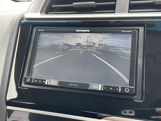 ホンダ フィット 13G F 鳥取県 2019(令1)年 4.1万km シャイニンググレーM ４・Ｗ・Ｄ/社外ナビ／フルセグ／ＤＶＤ／ＣＤ／ＢＴ/バックカメラ・ＥＴＣ/ホンダセンシング/レーダークルーズコントロール/レーンキープアシスト/アイドリングストップ/エコモードスイッチ/プッシュスタート/コンフォートビューＰＫＧ/電動格納ミラー/フロアマット