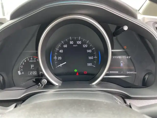 ホンダ フィット 13G F 鳥取県 2019(令1)年 4.1万km シャイニンググレーM ４・Ｗ・Ｄ/社外ナビ／フルセグ／ＤＶＤ／ＣＤ／ＢＴ/バックカメラ・ＥＴＣ/ホンダセンシング/レーダークルーズコントロール/レーンキープアシスト/アイドリングストップ/エコモードスイッチ/プッシュスタート/コンフォートビューＰＫＧ/電動格納ミラー/フロアマット