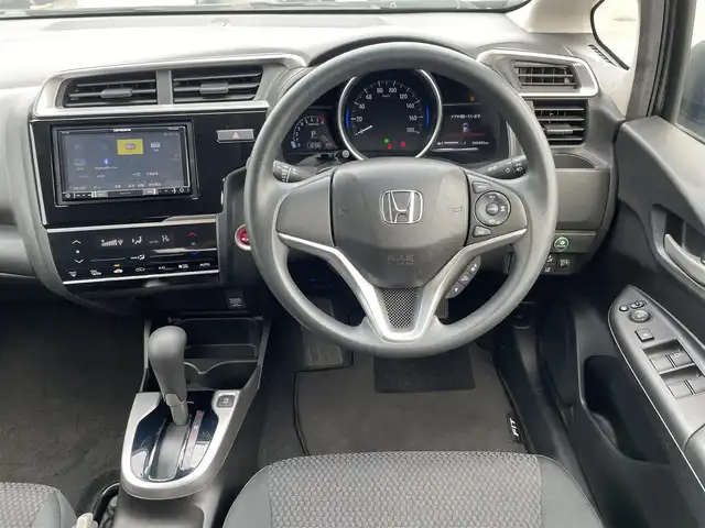 ホンダ フィット 13G F 鳥取県 2019(令1)年 4.1万km シャイニンググレーM ４・Ｗ・Ｄ/社外ナビ／フルセグ／ＤＶＤ／ＣＤ／ＢＴ/バックカメラ・ＥＴＣ/ホンダセンシング/レーダークルーズコントロール/レーンキープアシスト/アイドリングストップ/エコモードスイッチ/プッシュスタート/コンフォートビューＰＫＧ/電動格納ミラー/フロアマット