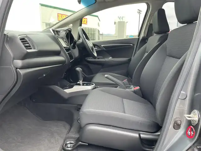 ホンダ フィット 13G F 鳥取県 2019(令1)年 4.1万km シャイニンググレーM ４・Ｗ・Ｄ/社外ナビ／フルセグ／ＤＶＤ／ＣＤ／ＢＴ/バックカメラ・ＥＴＣ/ホンダセンシング/レーダークルーズコントロール/レーンキープアシスト/アイドリングストップ/エコモードスイッチ/プッシュスタート/コンフォートビューＰＫＧ/電動格納ミラー/フロアマット