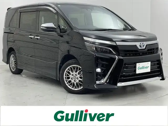 トヨタ ヴォクシー ハイブリッド ZS 煌Ⅲ 茨城県 2020(令2)年 6.6万km ブラック 純正10型ナビ/バックカメラ/フルセグ/純正フリップダウンモニター/衝突被害軽減ブレーキ/車線逸脱抑制装置/クルーズコントロール/オートマチックハイビーム/クリアランスソナー/両側電動スライドドア/ETC/ハーフレザーシート/シートヒーター/純正16インチAW/LEDヘッドライト/スマートキー