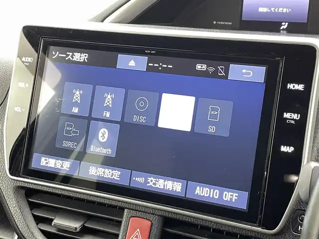 トヨタ ヴォクシー ハイブリッド ZS 煌Ⅲ 熊本県 2020(令2)年 6.6万km ブラック 純正10型ナビNSZT-Z68T(CD・DVD・フルセグ・BT・SD）/バックカメラ/純正フリップダウンモニター/ビルトインETC/トヨタセーフティーセンス/・駐車時支援パーキングサポートシステム/・衝突被害軽減ブレーキ/・車線逸脱抑制装置/・先行車発進お知らせ機能/・前後クリアランスソナー/クルーズコントロール/両側電動スライドドア/ハーフレザーシート/前席シートヒーター/リアオートエアコン/純正フロアマット/純正16インチAW/オートライト/LEDヘッドライト/オートマチックハイビーム/フォグランプ/スマートキー/プッシュスタート