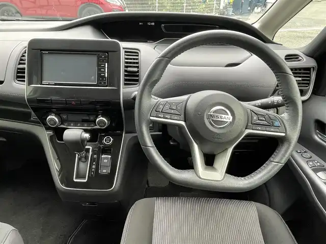 日産 セレナ ハイウェイスター V 大阪府 2021(令3)年 2.6万km ダークメタルグレー 純正7インチワイドナビ/　（フルセグTV/CD/DVD/Bluetooth/USB）/フリップダウンモニター/バックカメラ/両側パワースライドドア/前後ドライブレコーダー/プロパイロット/エマージェンシーブレーキ/クリアランスソナー/レーンキープアシスト/革巻ステアリング/LEDヘッドライト/純正16インチアルミホイール/純正フロアマット/ETC