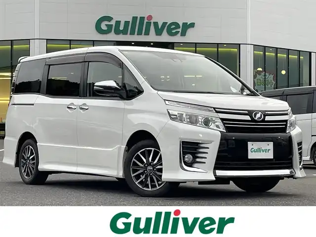 トヨタ ヴォクシー ZS 煌 島根県 2016(平28)年 6.8万km ホワイトパールクリスタルシャイン 登録時走行距離67915km/アルパインナビ(Bluetooth・AM・FM・CD・DVD)/フルセグTV/アルパインフリップダウンモニター/両側パワースライドドア/ETC/プッシュスタート/スマートキー/衝突被害軽減ブレーキ/横滑り防止装置/レーンキープアシスト/純正16インチAW/アイドリングストップ/ウォークスルー/保証書/取扱説明書/禁煙車