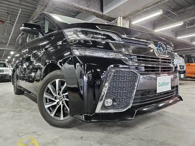 トヨタ ヴェルファイア ハイブリット ZR 福岡県 2016(平28)年 8.8万km ブラック 4WD/両側パワースライドドア/バックカメラ/ビルトインETC/ドライブレコーダー/レーダークルーズコントロール/クリアランスソナー/LEDヘッドランプ/オートライト/デュアルオートエアコン/木目調/革巻きコンビステアリング/ハーフレザーシート/前席パワーシート/運転席ポジションメモリー/2列目リラックスキャプテンシート/2列目マニュアルオットマン/純正17インチアルミホイール/スマートキー/プッシュエンジンスタート/禁煙車