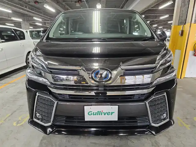 トヨタ ヴェルファイア ハイブリット ZR 福岡県 2016(平28)年 8.8万km ブラック 4WD/両側パワースライドドア/バックカメラ/ビルトインETC/ドライブレコーダー/レーダークルーズコントロール/クリアランスソナー/LEDヘッドランプ/オートライト/デュアルオートエアコン/木目調/革巻きコンビステアリング/ハーフレザーシート/前席パワーシート/運転席ポジションメモリー/2列目リラックスキャプテンシート/2列目マニュアルオットマン/純正17インチアルミホイール/スマートキー/プッシュエンジンスタート/禁煙車