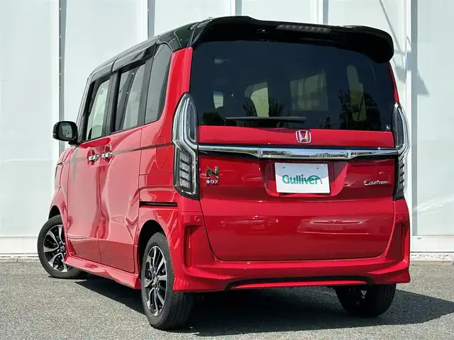 ホンダ Ｎ ＢＯＸ カスタム G L ホンダセンシング 福岡県 2019(令1)年 4.5万km ミラノレッド ・社外8インチナビ/（フルセグ/Bluetooth/USB/HDMI/AUX）/・社外10.2インチ後席用モニター/・両側パワースライドドア/・バックカメラ/・ドライブレコーダー/・ETC/・クルーズコントロール（追従走行可）/・横滑り防止装置/・衝突軽減システム/・レーンキープアシスト/・D/N席シートヒーター/・純正サイドエアロパーツ/・LEDヘッドライト/・電動格納ミラー/・純正ドアバイザー/・純正アルミホイール